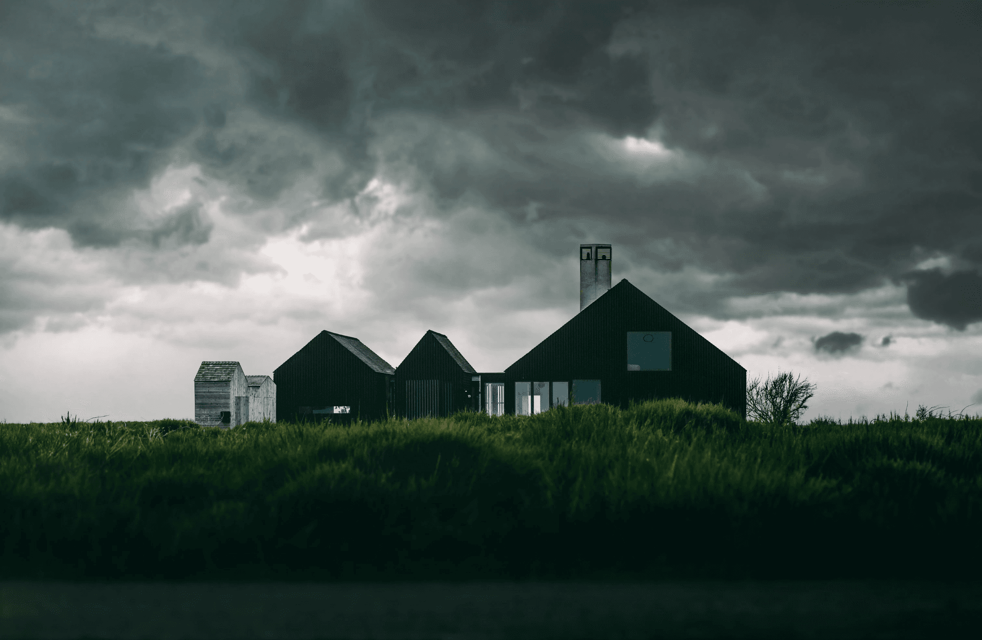 Storm clouds over rural buildings